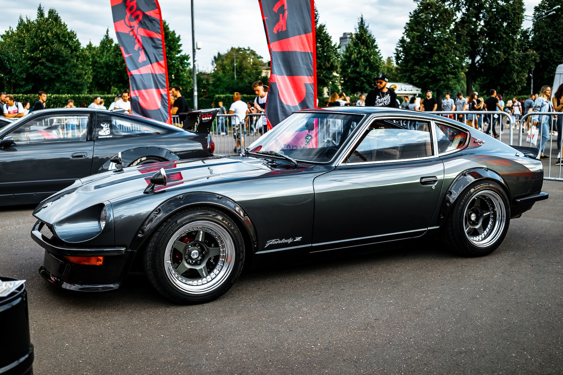 A tuned muscle car parked at an event