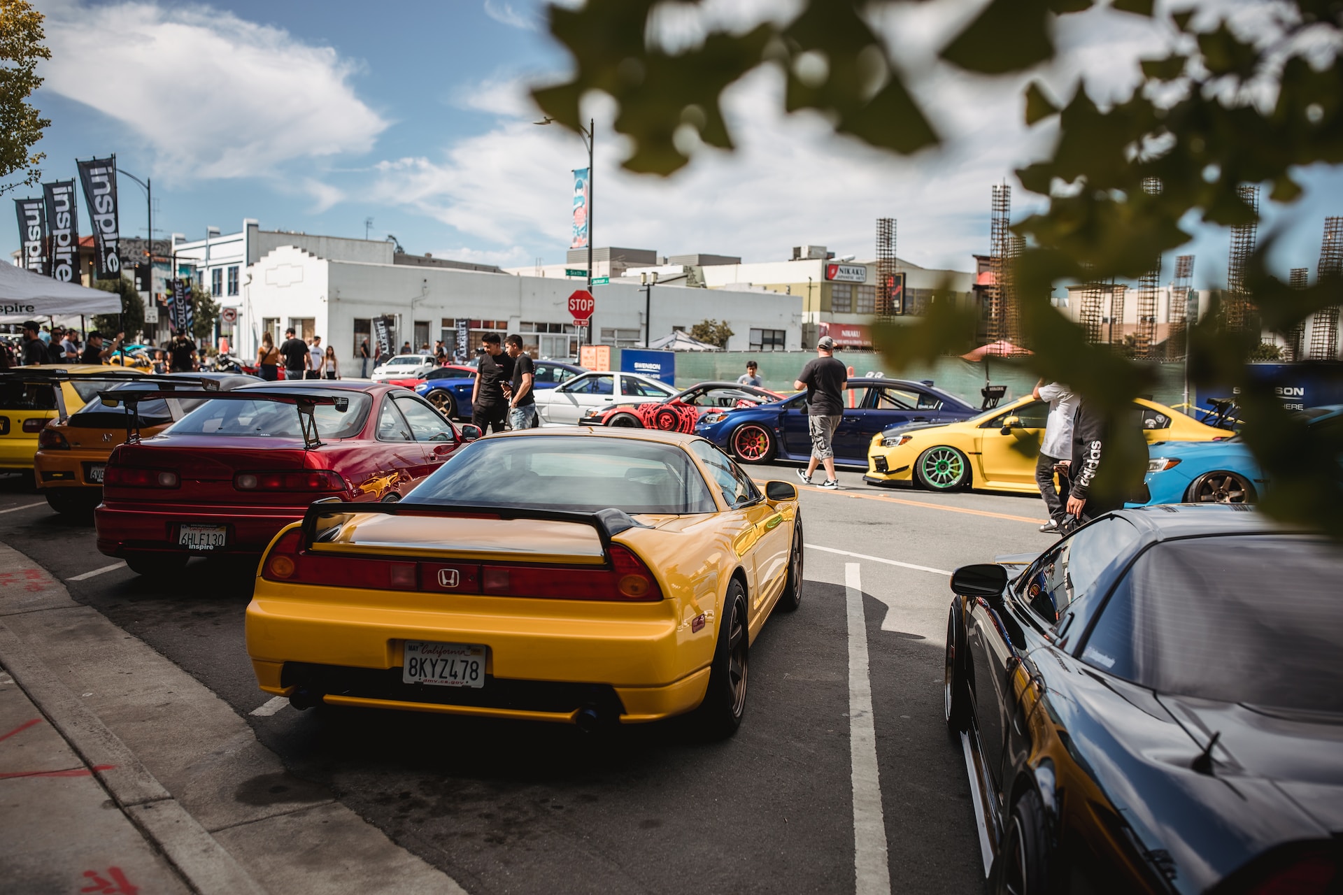A yellow sports car parked at an event